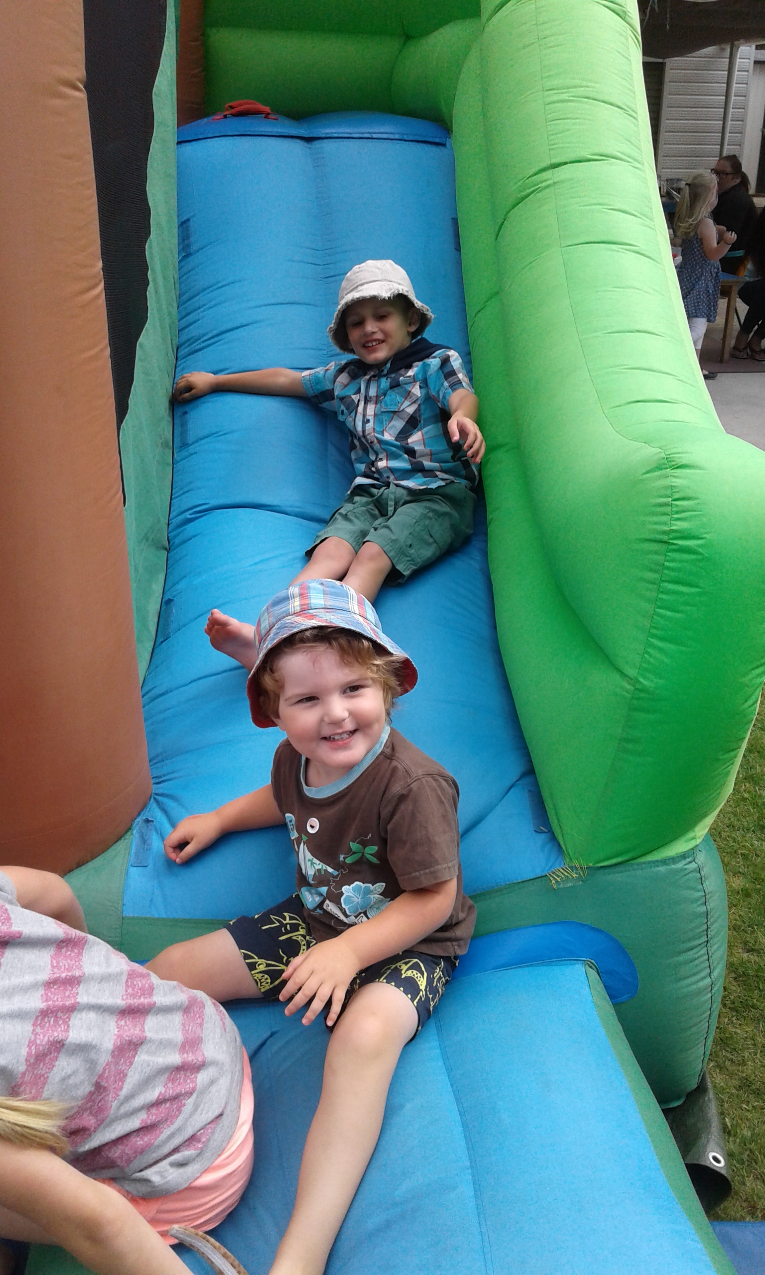 Down the slide at Te Pahu Preschool Family Fun Day