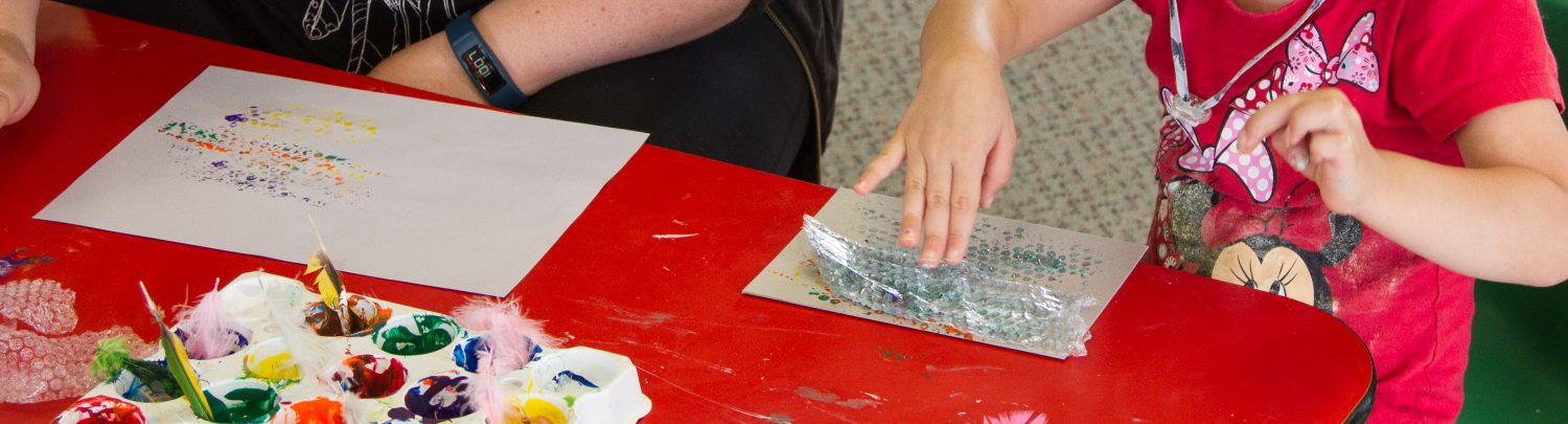Te Pahu Preschool children painting with bubble wrap